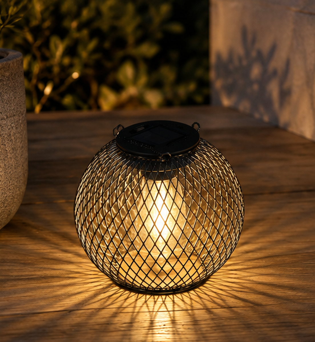 Valmere vintage solar lantern glowing on a warm wooden outdoor surface