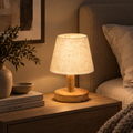 Valmere minimalist wooden table lamp with linen shade in a warm neutral bedroom